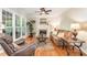 Cozy living room with a fireplace, plush seating, and neutral decor with natural light at 1003 Fairfax Woods Dr, Apex, NC 27502