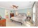 Well-lit main bedroom offers a ceiling fan and stylish decor at 1003 Fairfax Woods Dr, Apex, NC 27502