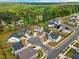 Aerial view of a residential neighborhood surrounded by lush green forest at 1005 Whispering Creek Ct, Knightdale, NC 27545