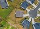 Aerial view of houses within a neighborhood, showing the layout of streets and yards at 1005 Whispering Creek Ct, Knightdale, NC 27545
