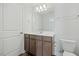 Modern bathroom features vanity, toilet, and a well-lit mirror at 1005 Whispering Creek Ct, Knightdale, NC 27545