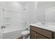 Clean bathroom featuring a shower and tub combo and a wooden vanity with chrome hardware at 1005 Whispering Creek Ct, Knightdale, NC 27545