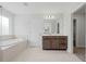 Bathroom with a soaking tub, vanity, tile flooring, and a separate walk-in shower at 1005 Whispering Creek Ct, Knightdale, NC 27545