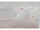 Spacious bedroom boasts tray ceilings, a ceiling fan, and bright natural light at 1005 Whispering Creek Ct, Knightdale, NC 27545