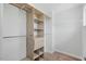 Spacious walk-in closet with built-in shelving units and ample hanging space at 1005 Whispering Creek Ct, Knightdale, NC 27545