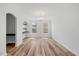 Dining area with hardwood floors, modern lighting, built-in shelving and large windows at 1005 Whispering Creek Ct, Knightdale, NC 27545