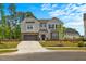 Charming two-story home with stone accents, lush lawn, and an inviting driveway at 1005 Whispering Creek Ct, Knightdale, NC 27545