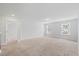 Open living room provides view into hallway and windows bring in ample natural light at 1005 Whispering Creek Ct, Knightdale, NC 27545