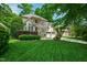 Beautiful two-story home featuring a manicured lawn, stone accents, and an attached two-car garage at 10113 San Remo Pl, Wake Forest, NC 27587