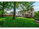 Expansive backyard with a deck, patio area, and ample green space at 10113 San Remo Pl, Wake Forest, NC 27587