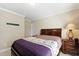 Inviting bedroom featuring neutral walls, plush carpet, and an inviting bed with stylish bedding and furniture at 10113 San Remo Pl, Wake Forest, NC 27587