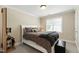 Cozy bedroom featuring neutral walls, plush carpet, and a comfortable bed with stylish bedding and pillows at 10113 San Remo Pl, Wake Forest, NC 27587