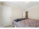 Comfortable bedroom featuring neutral walls, plush carpet, and a inviting bed with stylish bedding and pillows at 10113 San Remo Pl, Wake Forest, NC 27587
