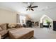 This bonus room has a comfortable couch, desk setup, storage, and plenty of open space at 10113 San Remo Pl, Wake Forest, NC 27587