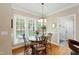 Bright breakfast nook featuring large windows and a view of the backyard at 10113 San Remo Pl, Wake Forest, NC 27587