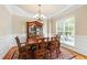 Elegant dining room with decorative chandelier and wainscoting at 10113 San Remo Pl, Wake Forest, NC 27587