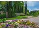 Welcoming entrance to Porto Fino community with beautiful landscaping and colorful flower beds at 10113 San Remo Pl, Wake Forest, NC 27587