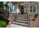 Inviting front entrance featuring stone steps and a charming front door at 10113 San Remo Pl, Wake Forest, NC 27587
