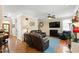 Comfortable living room with hardwood floors, fireplace, and leather sofas at 10113 San Remo Pl, Wake Forest, NC 27587