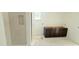 Bathroom with a tiled shower and a dark vanity cabinet without a countertop at 102 Gobbler Dr, Smithfield, NC 27577