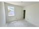 A bedroom under construction features a single window and a doorway at 102 Gobbler Dr, Smithfield, NC 27577
