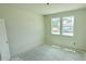 A bedroom under construction featuring two windows providing natural light to the space at 102 Gobbler Dr, Smithfield, NC 27577