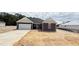 Charming new construction home with a two-car garage and unfinished landscaping at 102 Gobbler Dr, Smithfield, NC 27577