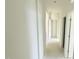 A view down a long hallway featuring several doorways at 102 Gobbler Dr, Smithfield, NC 27577