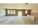 Spacious kitchen featuring sliding glass door and multiple windows for an abundance of natural light at 102 Gobbler Dr, Smithfield, NC 27577