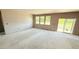 Spacious living room featuring sliding glass door and multiple windows for an abundance of natural light at 102 Gobbler Dr, Smithfield, NC 27577
