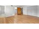 Bedroom featuring hardwood flooring, an ensuite bath, and a large closet at 1024 Chalmers St, Durham, NC 27707