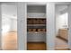 Hall closet featuring a shelf and storage baskets at 1024 Chalmers St, Durham, NC 27707