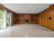Spacious living room featuring a brick fireplace with built-in shelving and sliding doors to the exterior at 1024 Chalmers St, Durham, NC 27707