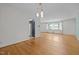 Open concept living room featuring hardwood floors, neutral paint, and bright natural light at 1024 Chalmers St, Durham, NC 27707