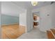 A view of the bright living room featuring hardwood floors and neutral paint at 1024 Chalmers St, Durham, NC 27707