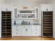 Custom bar area with wine coolers, custom cabinets, and elegant countertop at 1027 S Duke St, Durham, NC 27707