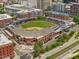 Aerial view of a baseball field and Durham city, surrounded by buildings and roadways at 1027 S Duke St, Durham, NC 27707