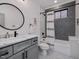 Charming bathroom with mosaic tile, shower-tub combo, and stylish vanity at 1027 S Duke St, Durham, NC 27707