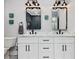 Modern bathroom with double sinks, marble countertop, and stylish fixtures at 1027 S Duke St, Durham, NC 27707