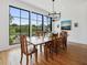 Bright dining area boasts hardwood floors and a large window with scenic views at 1027 S Duke St, Durham, NC 27707