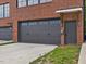 Garage with exterior brick and paved driveway at 1027 S Duke St, Durham, NC 27707