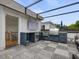 Rooftop deck with outdoor kitchen, grill, and patio furniture at 1027 S Duke St, Durham, NC 27707