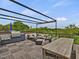 Spacious rooftop deck featuring an outdoor kitchen, dining table, and comfortable seating area with scenic views at 1027 S Duke St, Durham, NC 27707