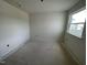 Bedroom under construction with a neutral floor, white walls, and a single hung window overlooking the neighborhood at 1029 Mountain Crown St, Durham, NC 27703