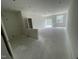 Spacious unfinished room with sliding glass doors, new white paint and multiple electrical connection points at 1029 Mountain Crown St, Durham, NC 27703
