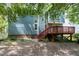Backyard of house with a wooden deck attached at 103 Trent Woods Way, Cary, NC 27519