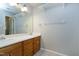 Bathroom with double sink vanity and overhead lights at 103 Trent Woods Way, Cary, NC 27519