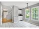 Bright dining area adjacent to kitchen with white cabinets, granite counters and natural light at 103 Trent Woods Way, Cary, NC 27519