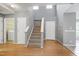 Entryway showcasing hardwood floors, carpeted stairs, and a neutral color palette at 103 Trent Woods Way, Cary, NC 27519