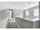 Open hallway area with chandelier lighting and lots of natural light at 103 Trent Woods Way, Cary, NC 27519